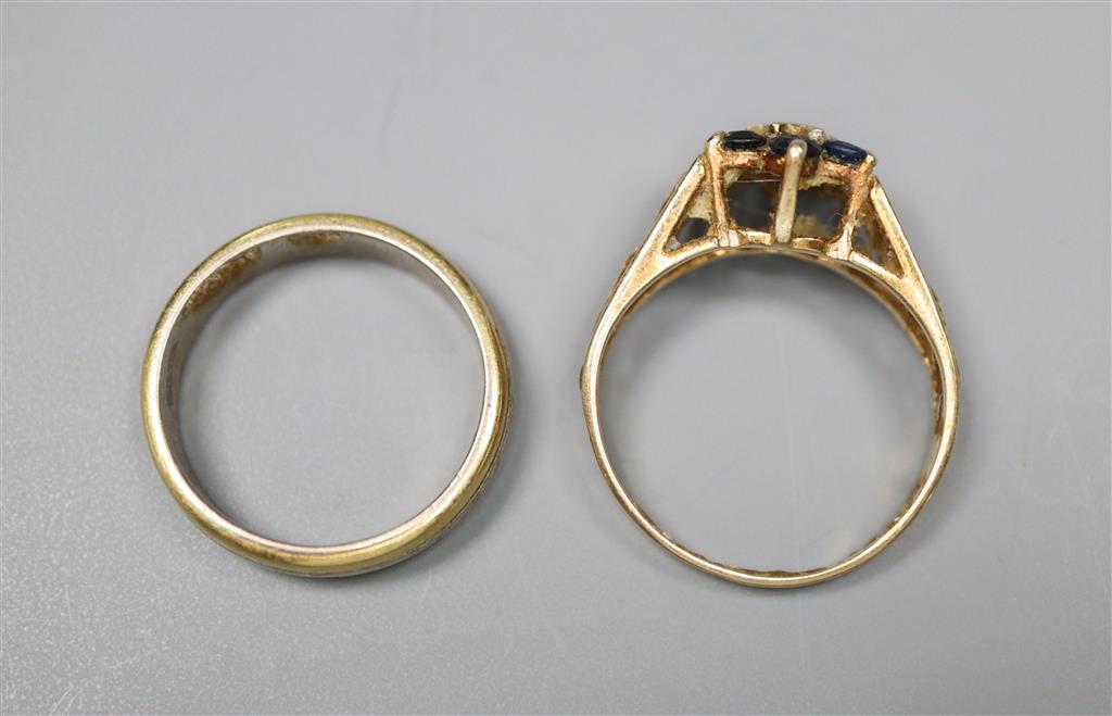 A Middle Eastern three colour metal ring and 9ct gold gem set ring, gross 2 grams.